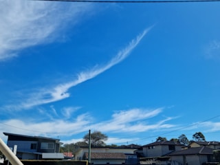 A team installing fiber optic cables in a suburban neighborhood.