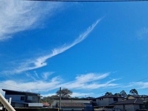 A team installing fiber optic cables in a suburban neighborhood.