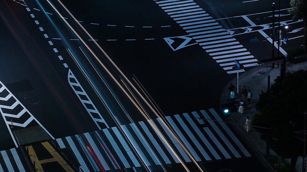 an aerial view of a street intersection at night