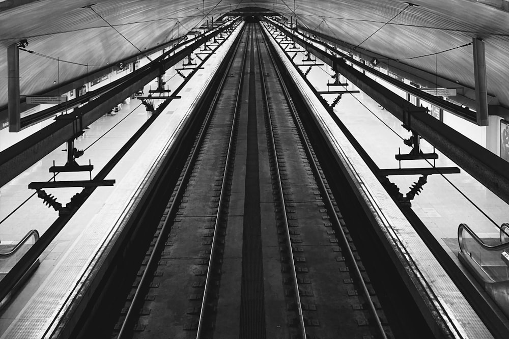 a black and white photo of a train station