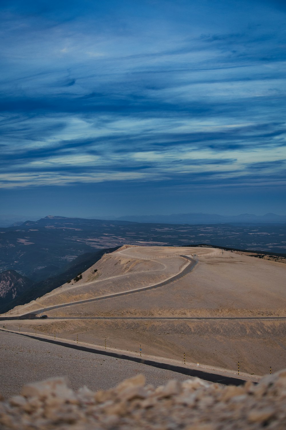 a view of a road in the middle of a desert