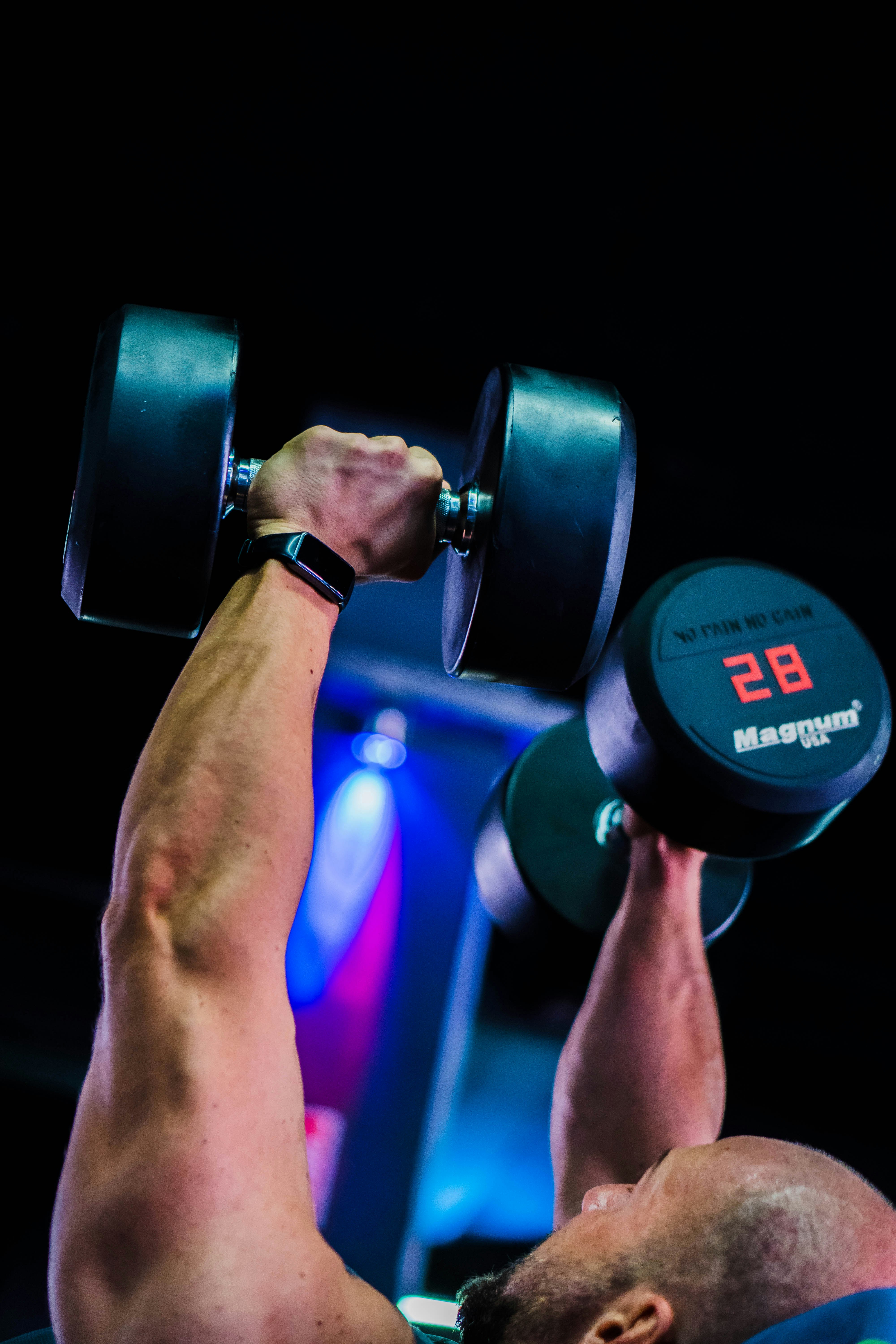 a man doing a back press with a barbell