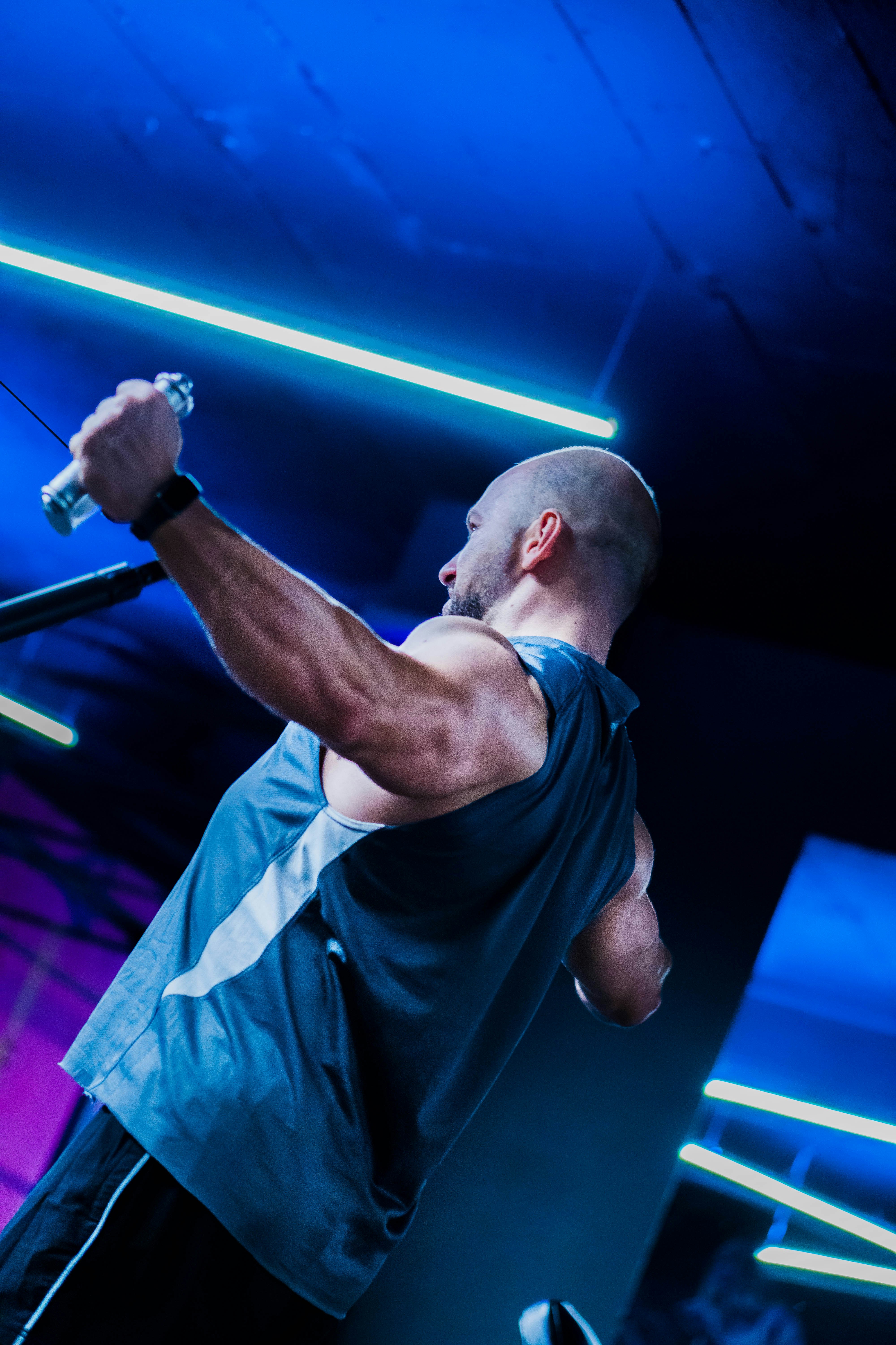 a man holding a video game controller in his right hand