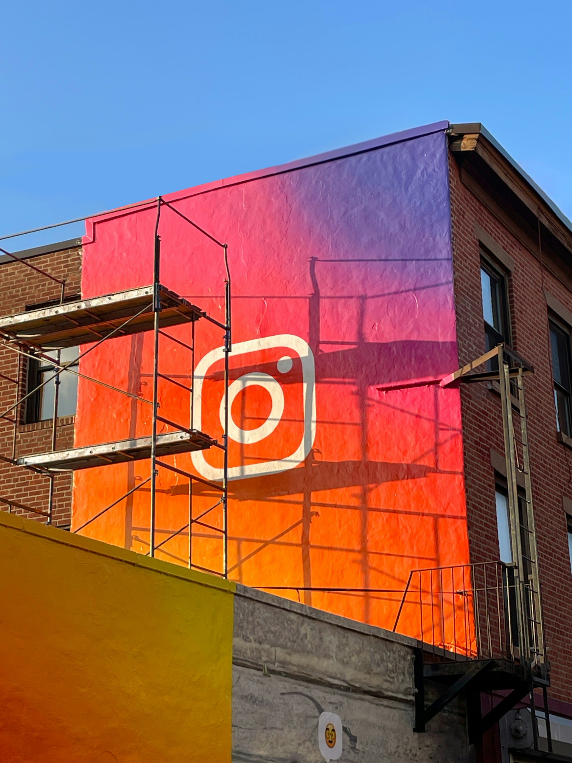a building with scaffolding around it and a sign on the side of it