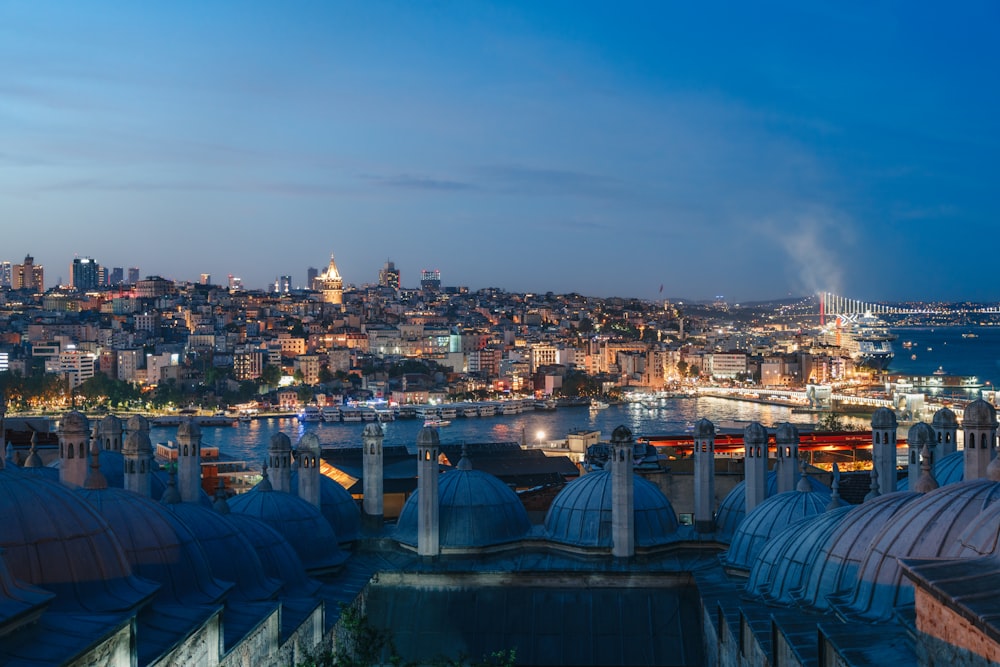 a view of a city at night from the top of a building