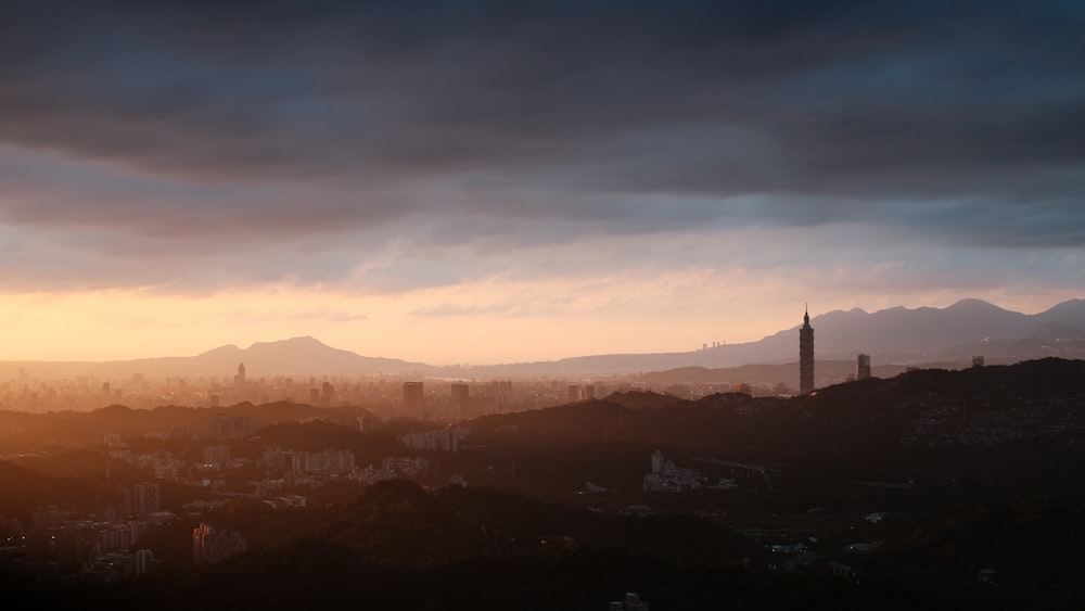 a view of a city with mountains in the background