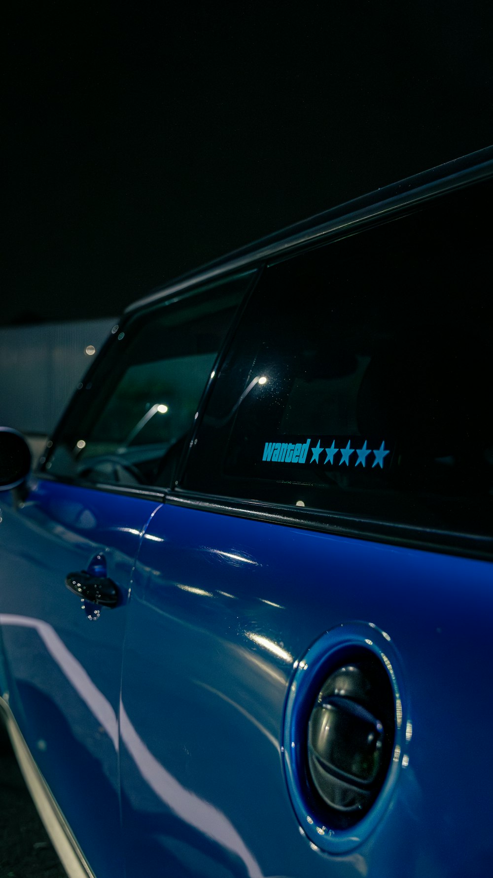 a close up of a blue car with stars on it
