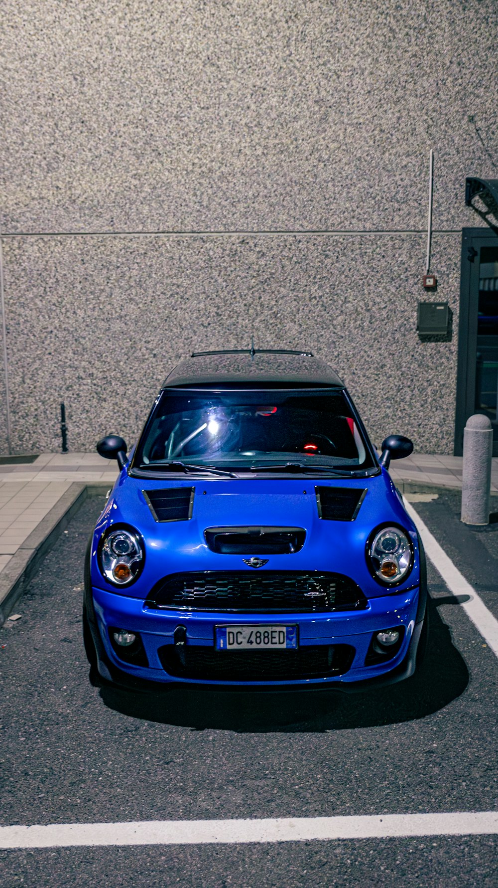 a blue car parked in a parking space