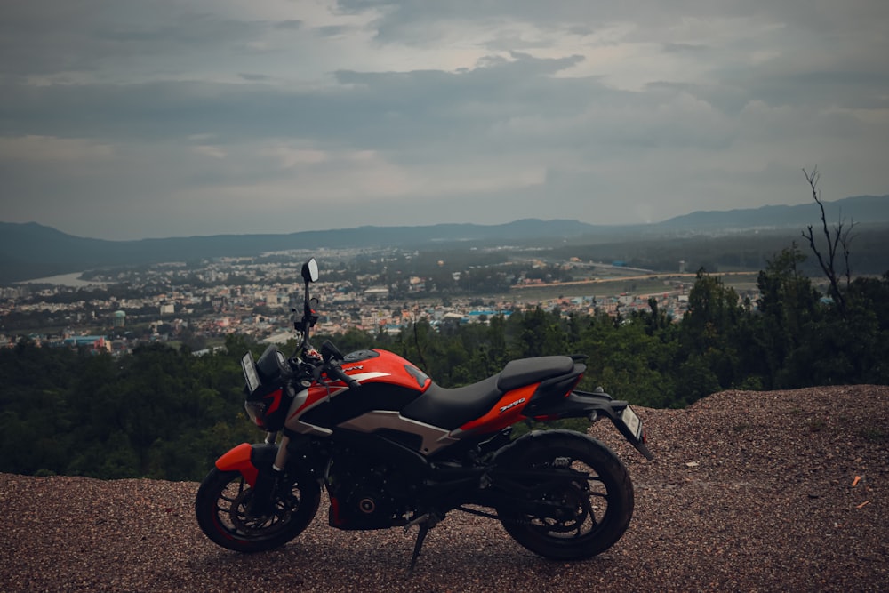 a motorcycle parked on top of a hill