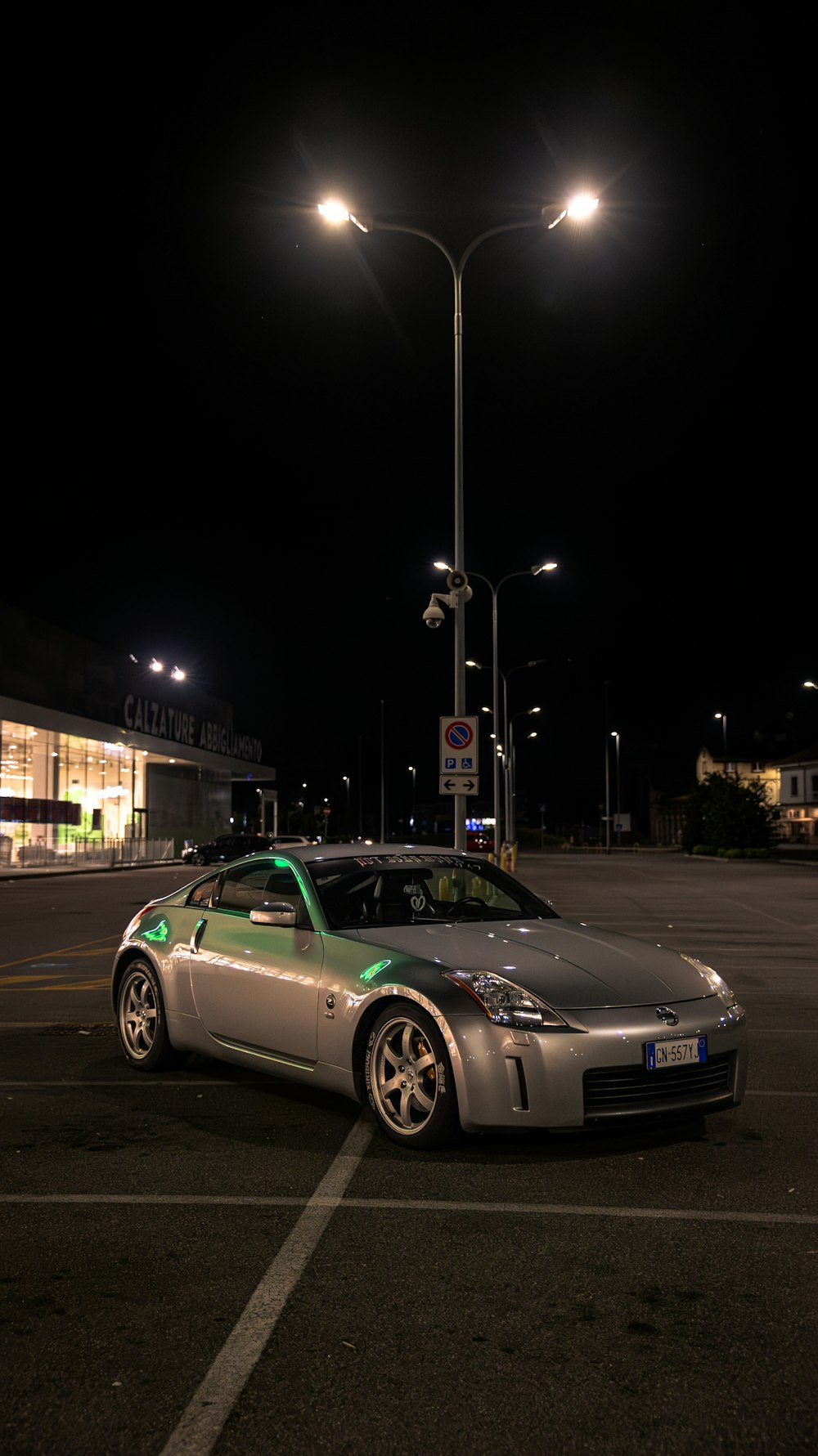 a car parked in a parking lot at night