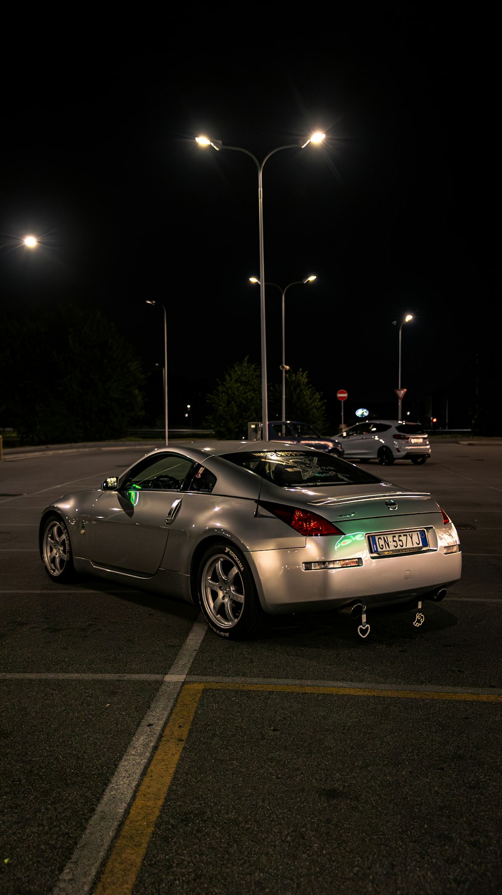 a car parked in a parking lot at night