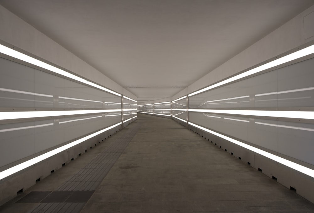 a long tunnel with white lights on either side of it