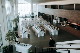 a room filled with lots of tables and chairs