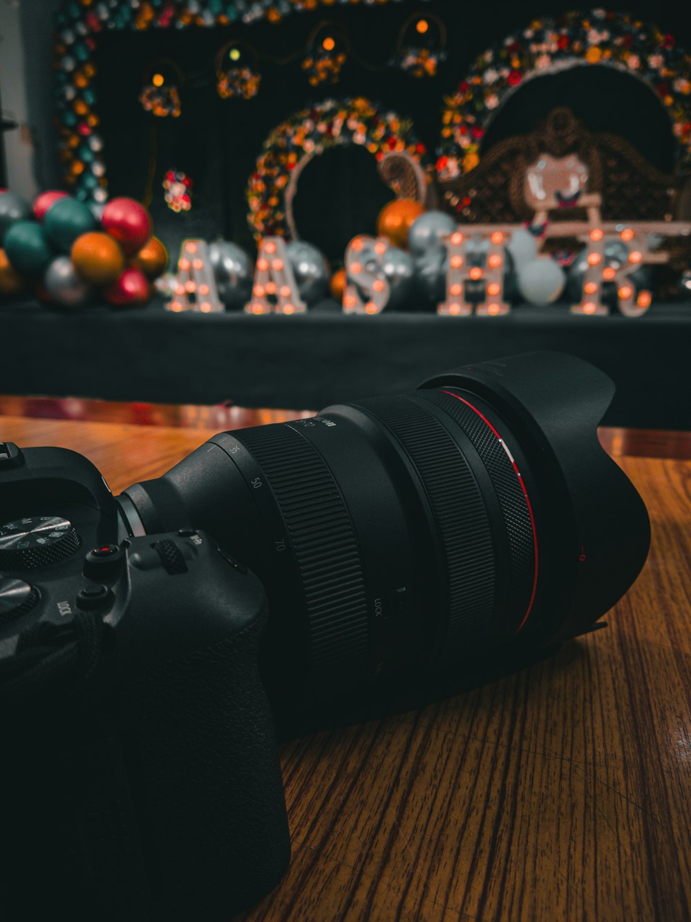 a camera lens sitting on top of a wooden table