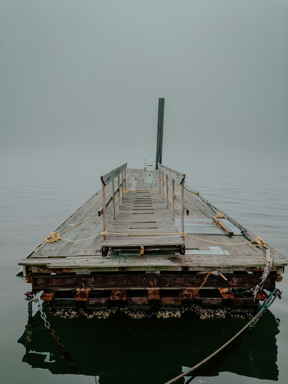 a dock in the middle of a body of water