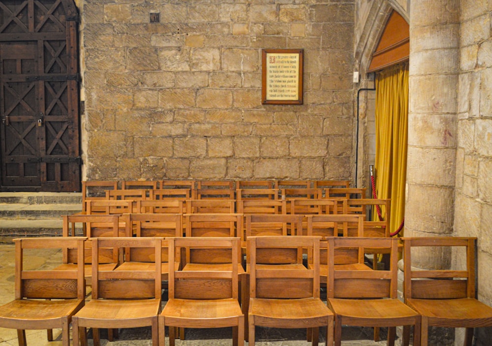 a bunch of chairs that are in a room