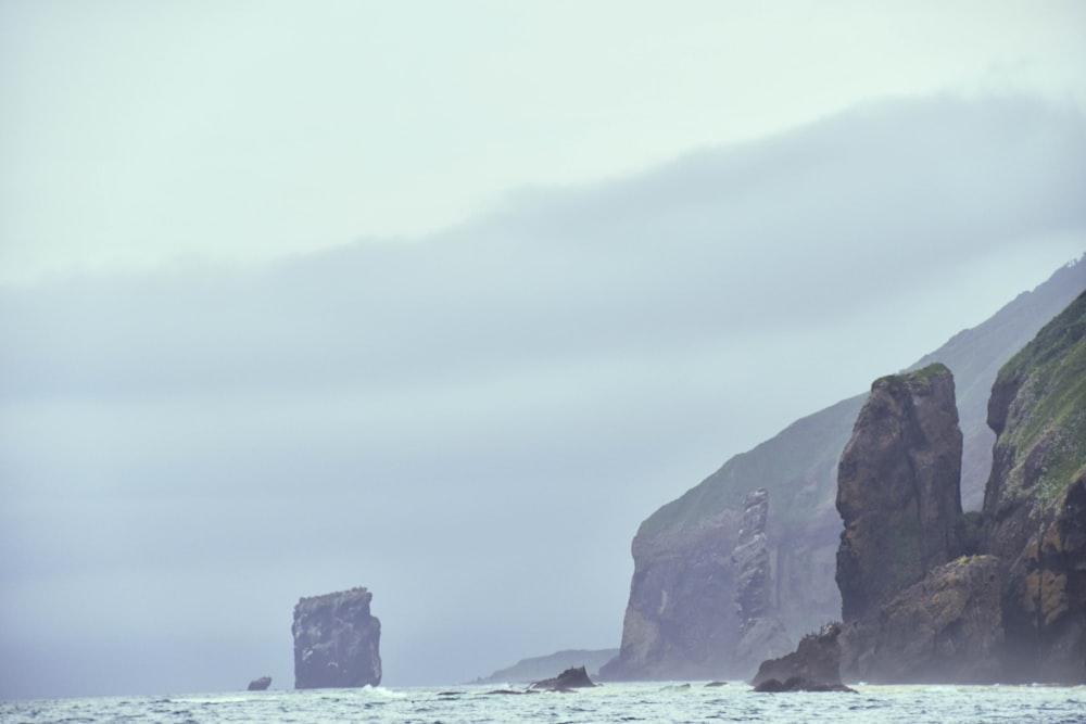 a person riding a surfboard on a body of water