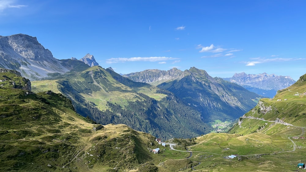 a view of a valley with mountains in the background