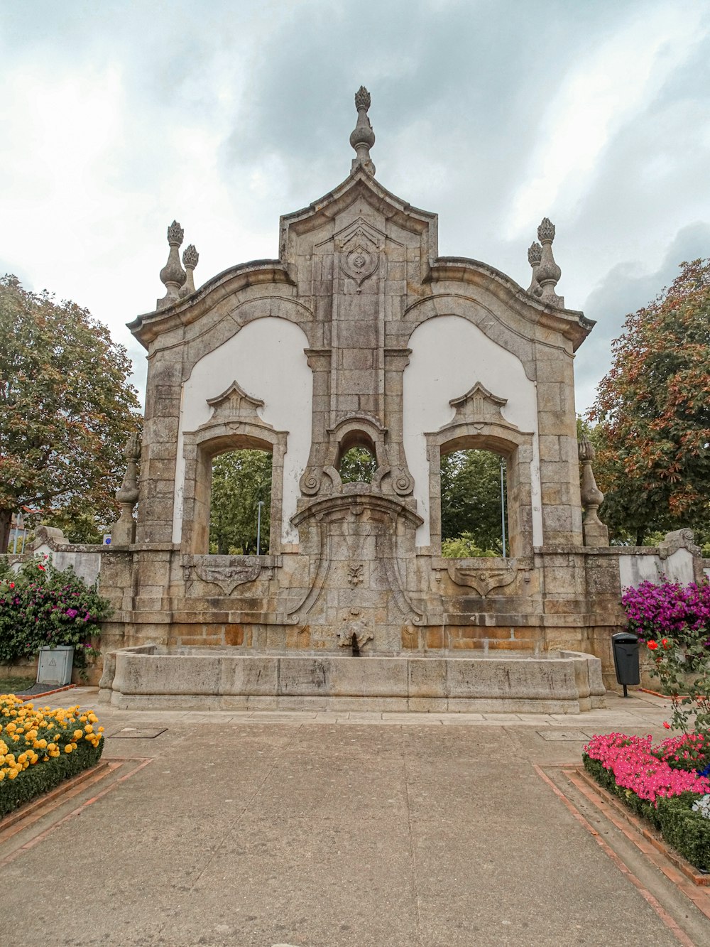 a building with a fountain in the middle of it