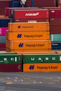 a bunch of cargo containers stacked on top of each other
