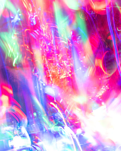 An abstract artwork glowing with neon colors, evoking the energy of city nights.