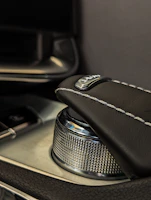 Detail of the durable TPV material resisting heat and wear inside a premium exotic car interior.