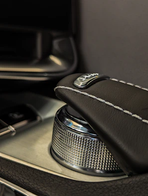 Detail of the durable TPV material resisting heat and wear inside a premium exotic car interior.