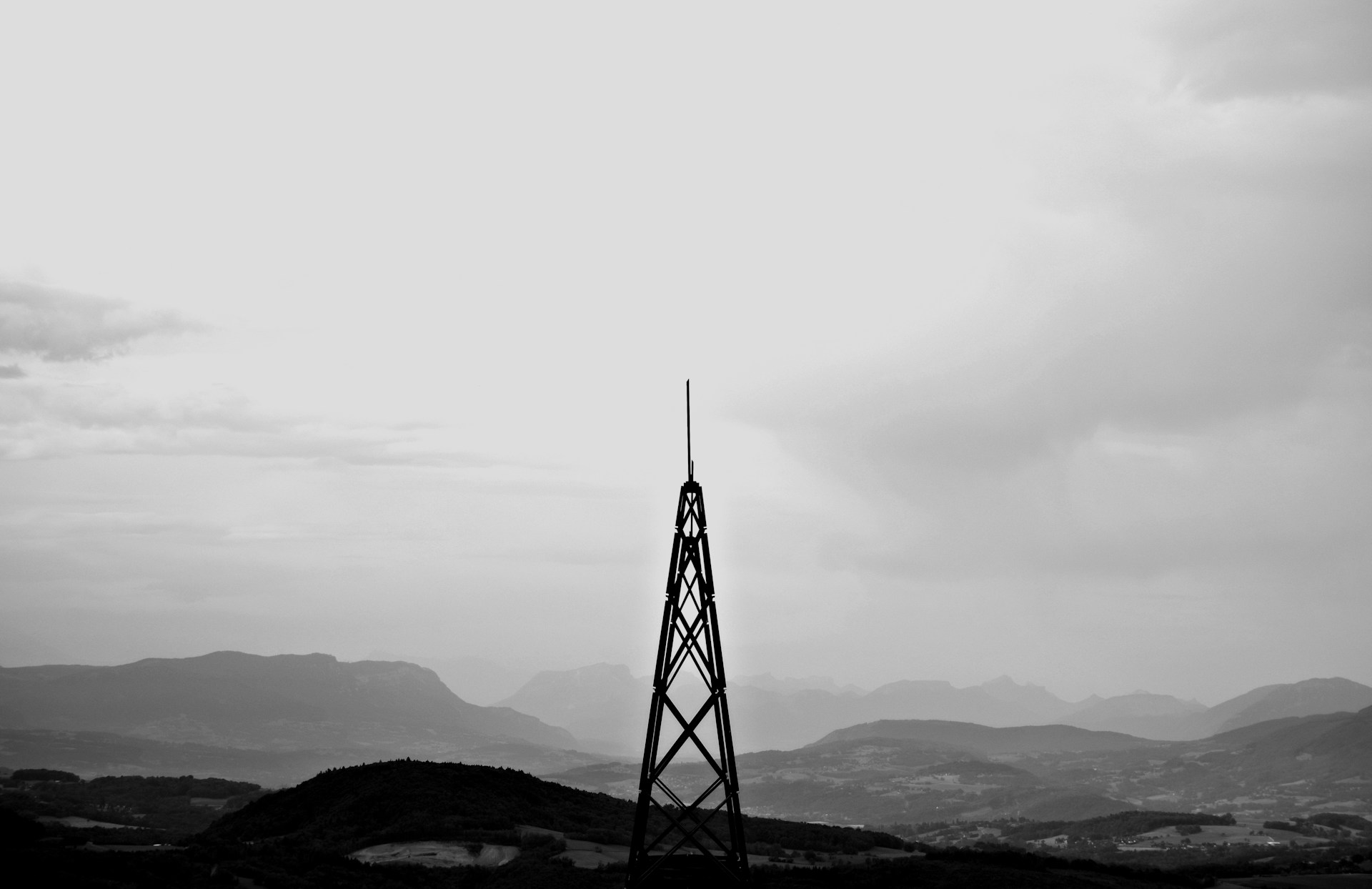 a black and white photo of a radio tower
