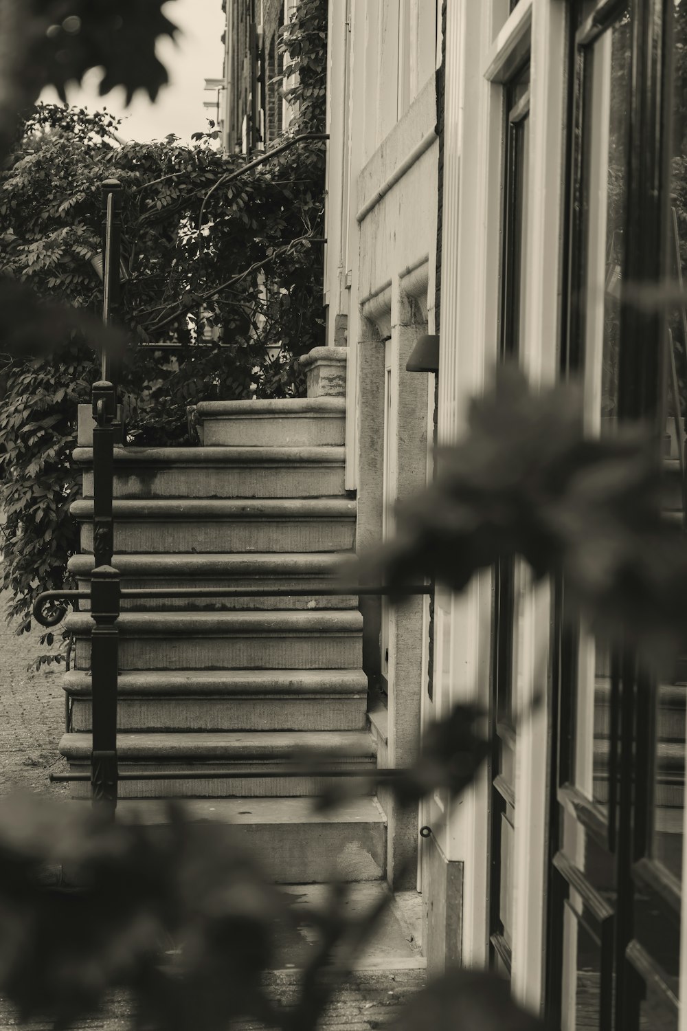 a black and white photo of a person walking down a street