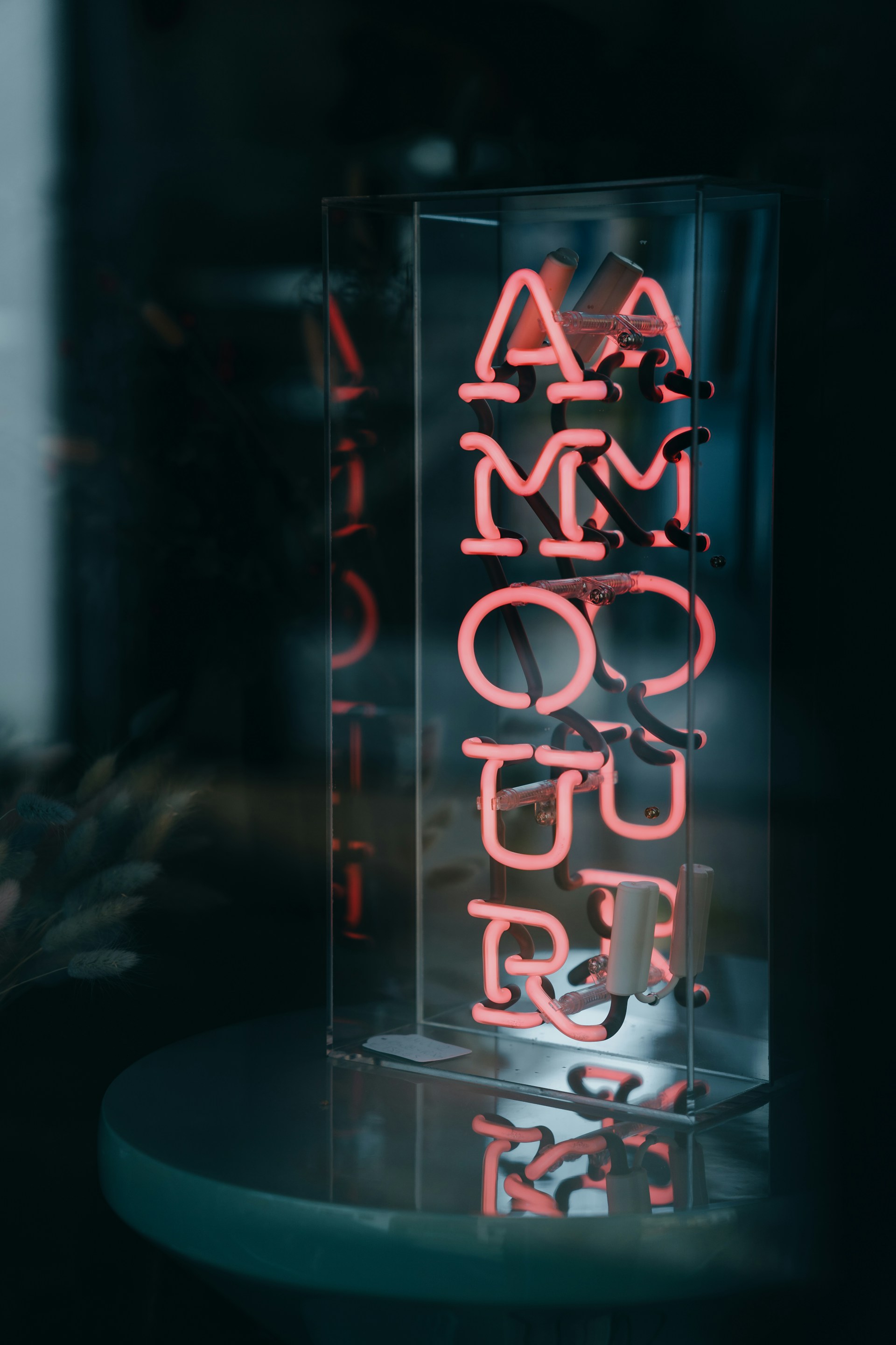 a neon sign sitting on top of a table