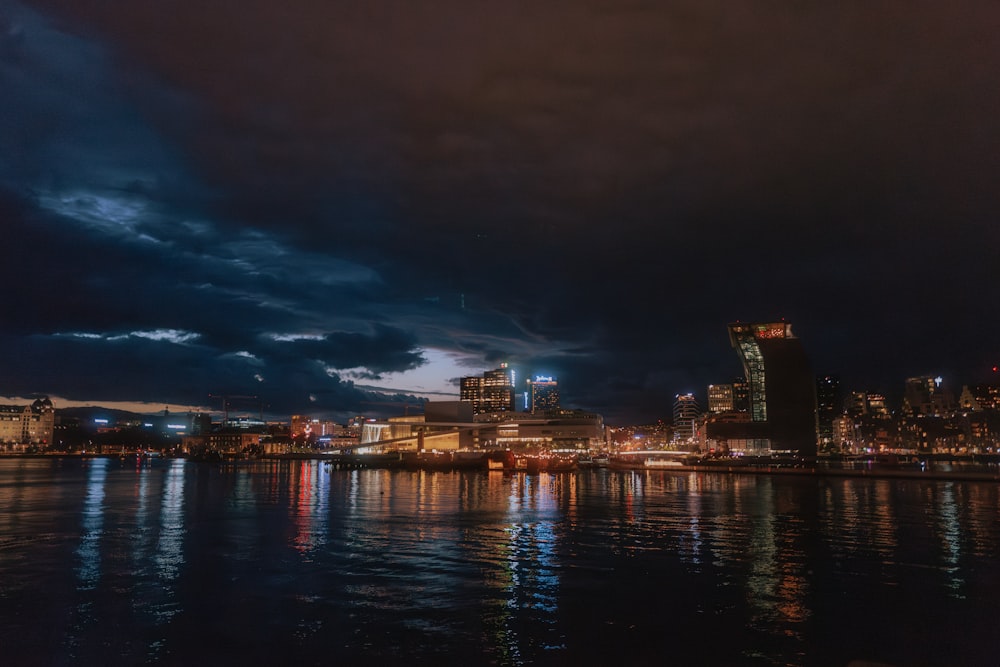 a city skyline is lit up at night