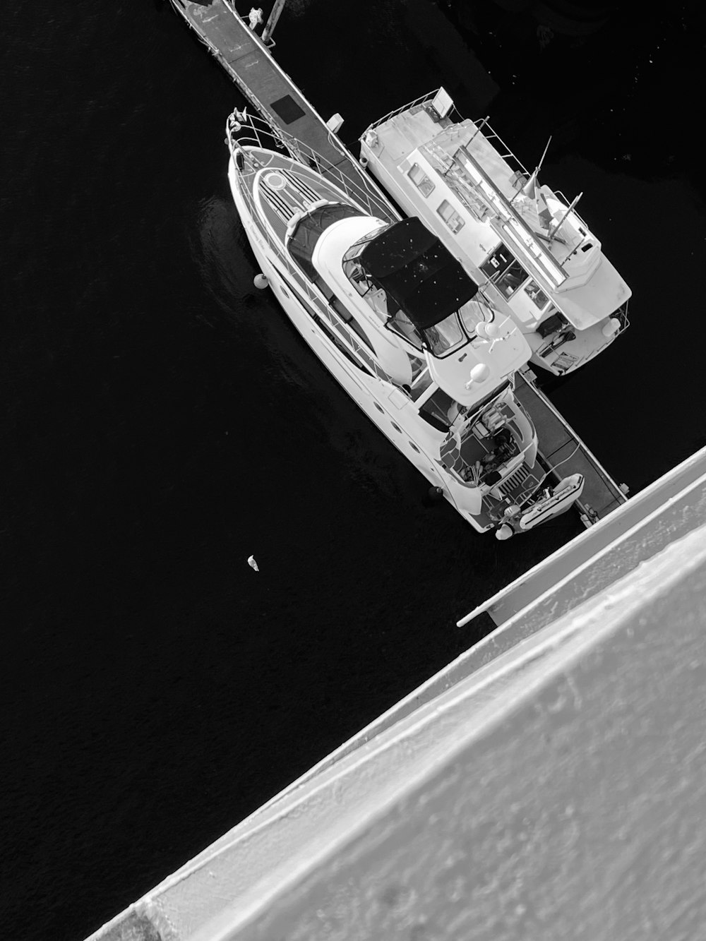a black and white photo of a boat in the water