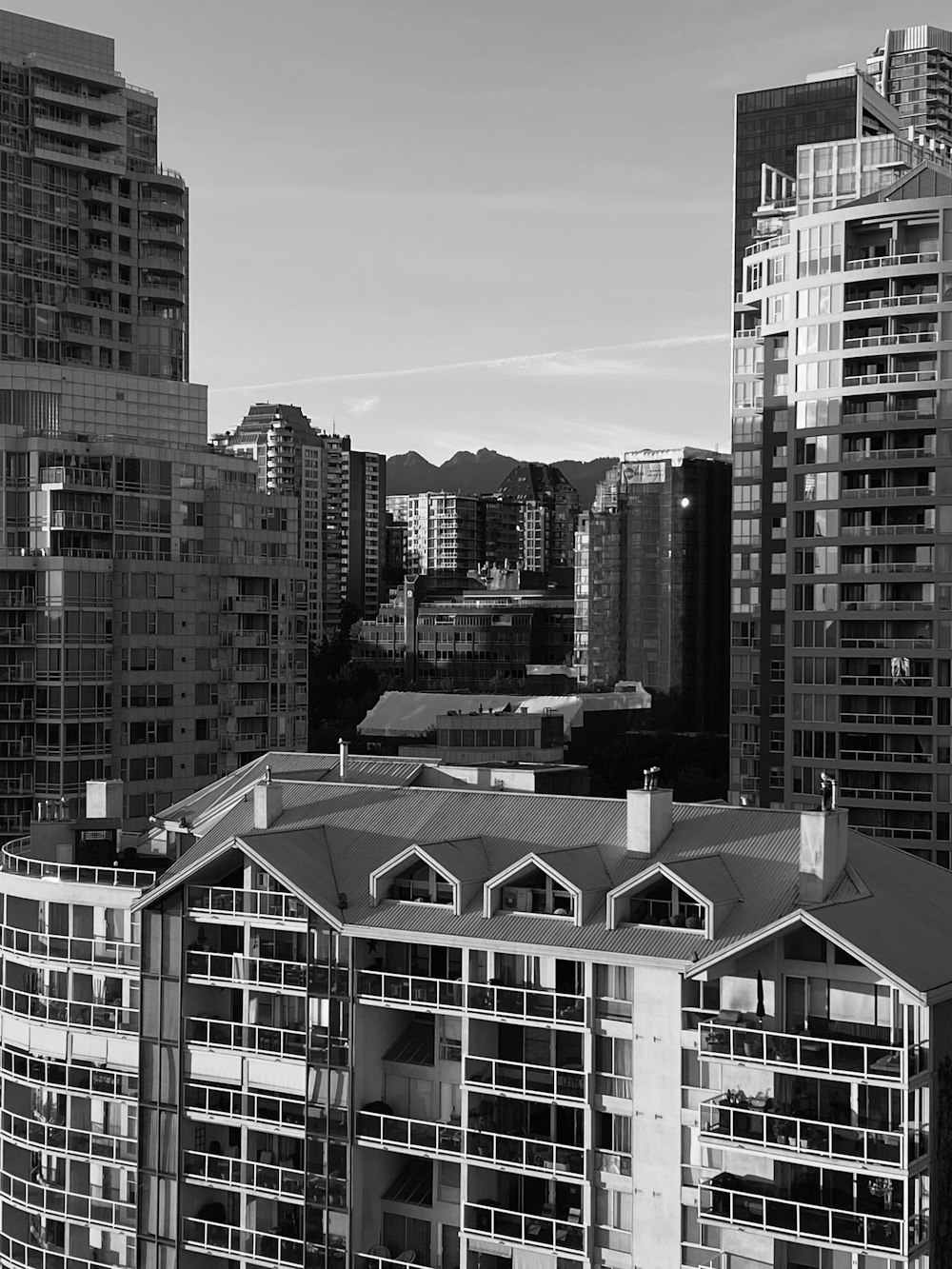 a black and white photo of buildings in a city