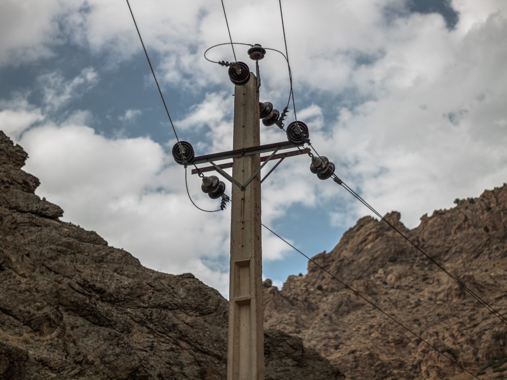 a telephone pole with multiple wires attached to it