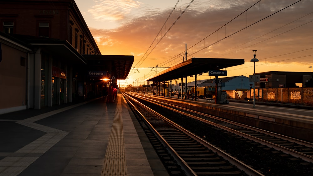 a train station with a train on the tracks