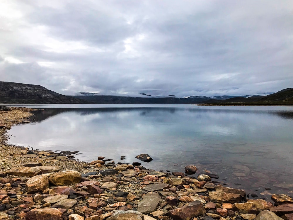 a large body of water surrounded by rocks