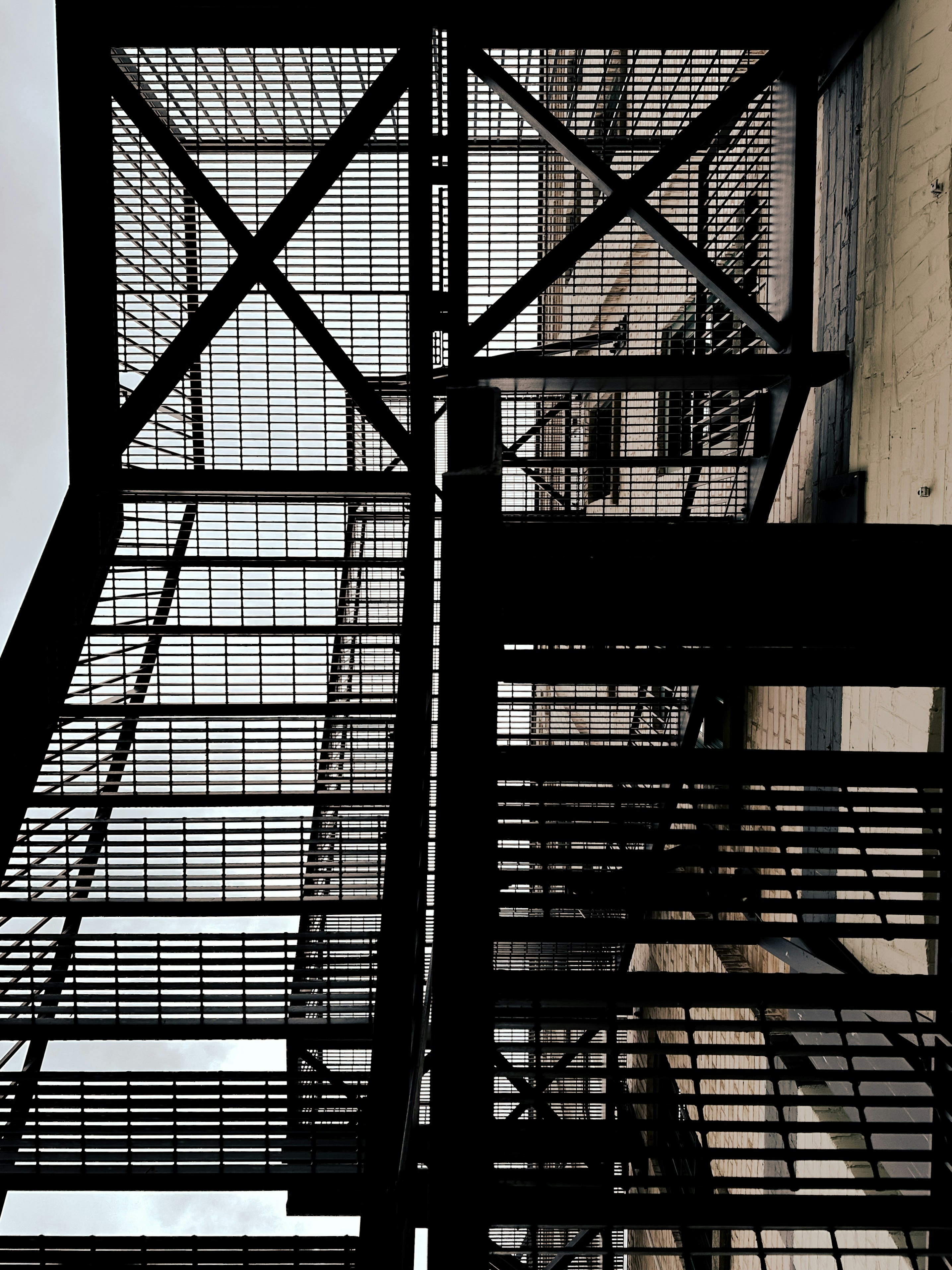 a tall metal structure with a clock on it's side