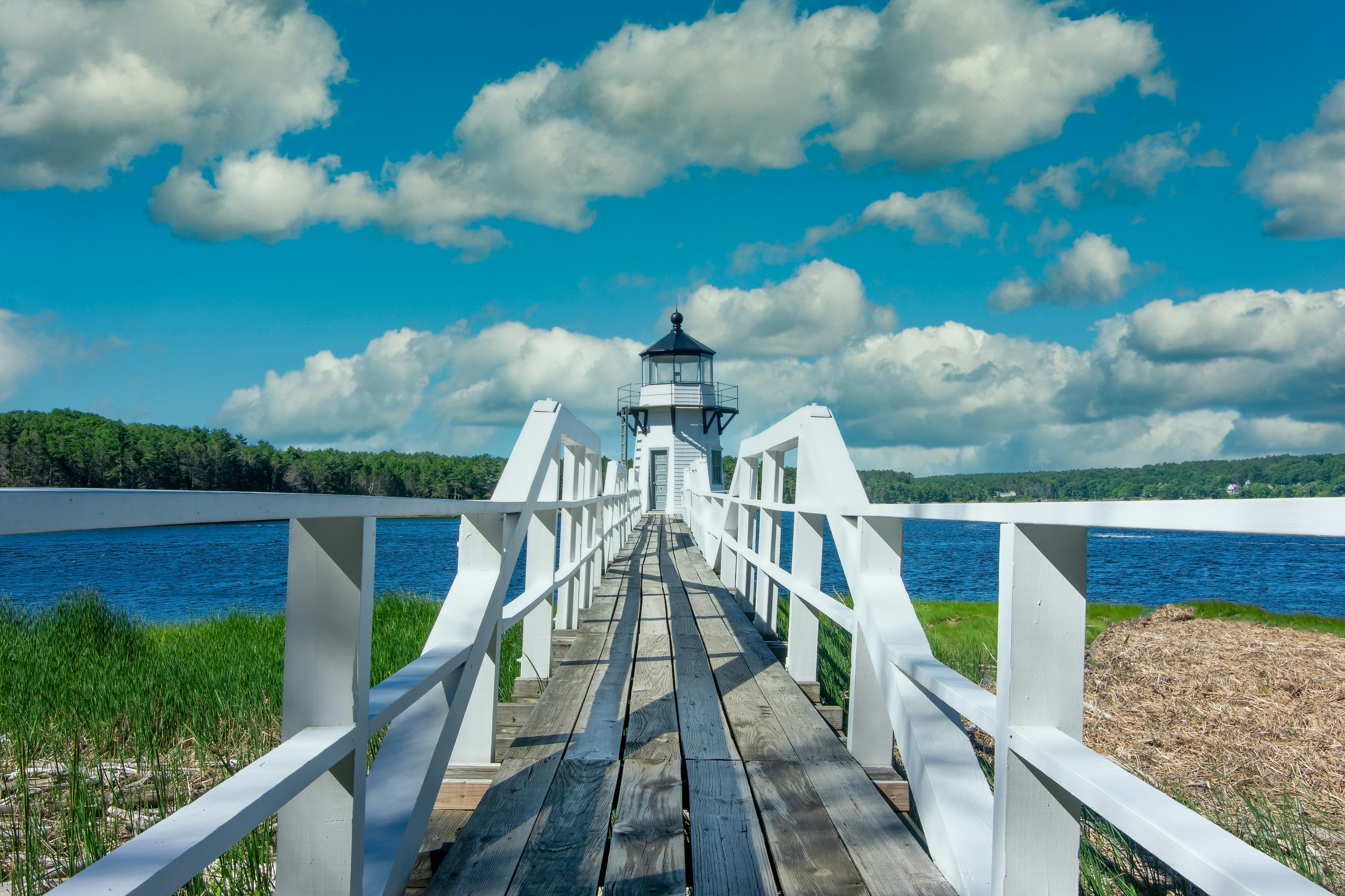 a wooden bridge with a light house on top of it, Doubling Point Lighthouse in Maine