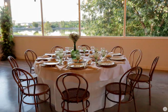 Elegant table set for a family gathering with natural light streaming in.
