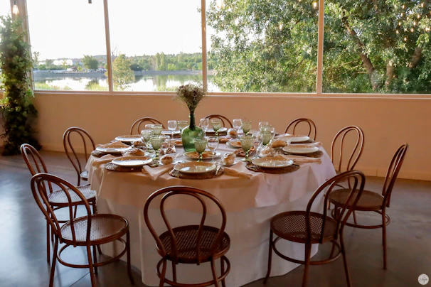 Elegant table set for a family gathering with natural light streaming in.