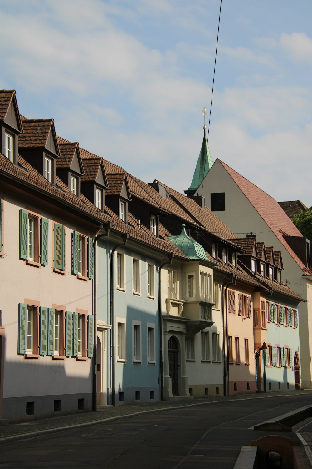 a row of houses with a steeple on top