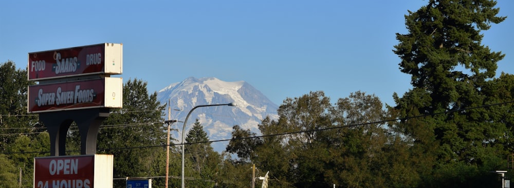 a gas station with a mountain in the background