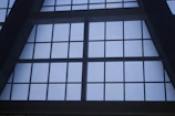 Wide shot of a freshly installed aluminum window frame in a commercial building.