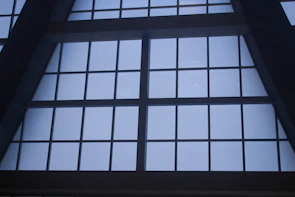 Wide shot of a newly installed aluminum window frame in a commercial building.