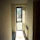 A stylish hallway featuring a textured jute rug runner with sunlight streaming in.