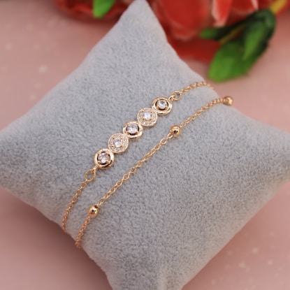 a close up of a diamond bracelet on a pillow