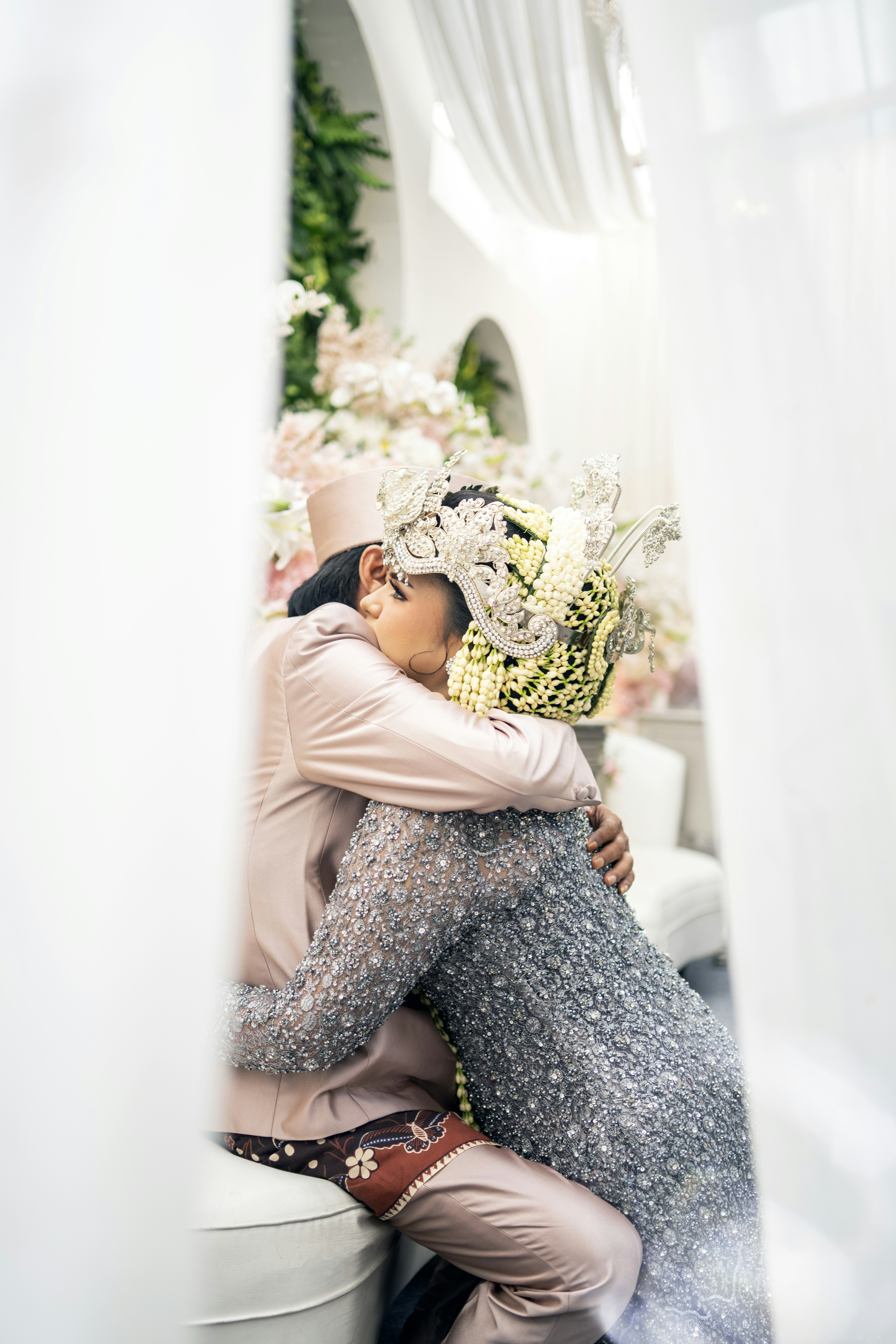 a couple of people that are hugging each other