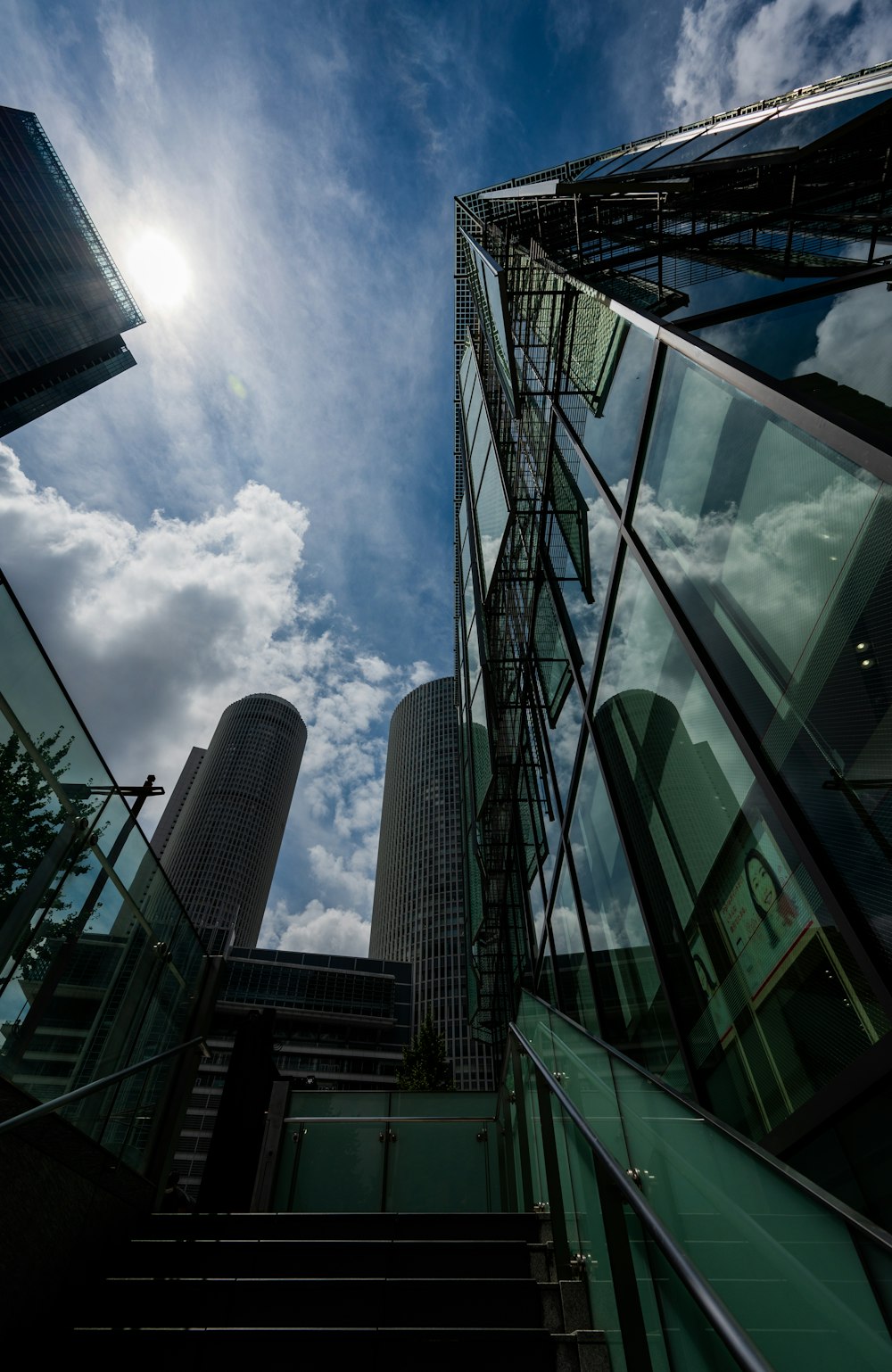 a very tall building next to some very tall buildings