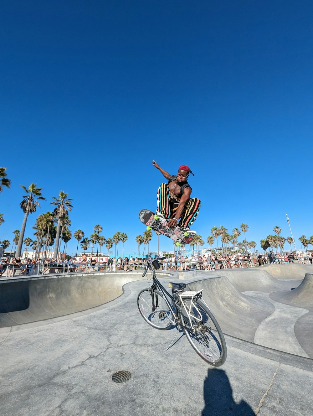 a man flying through the air while riding a skateboard