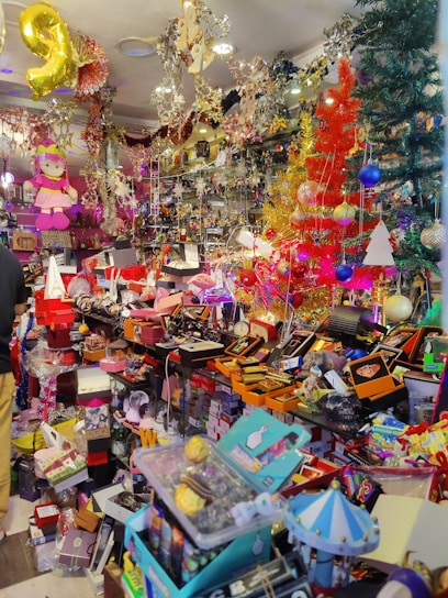 A vibrant shopping cart filled with discounted products and gift boxes